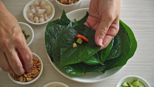 Miang kham - A royal leaf wrap appetizer - It is a traditional Southeast Asian snack from Thailand and Laos