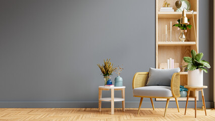 Living room interior in warm tones with armchair on empty dark wall background. © Vanitjan