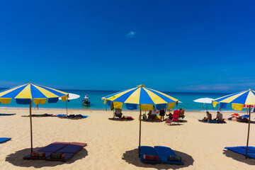 Umbrella beach chair sea beach against blue sky