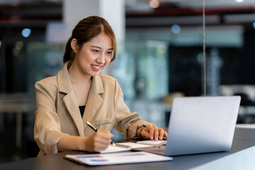 Asian girl with laptop, success happy pose. E-commerce, University education, internet Technology, or startup small business concept. Modern office or living room with copy space