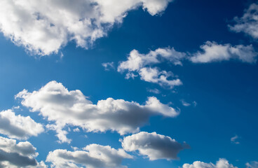 Naklejka na ściany i meble fluffy clouds and blue sky,arranged in an interesting form