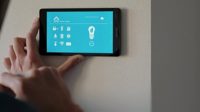 Woman holding smartphone with smart home control