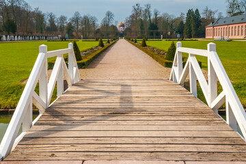 A wooden bridge leading to the walkway of the orangery parterre in the garden of the famous...