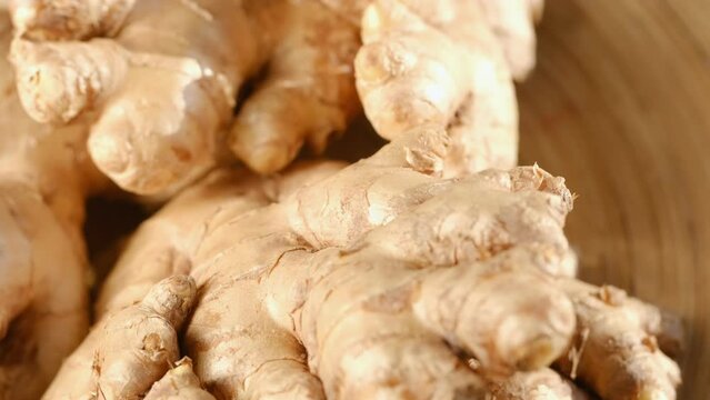 Whole ginger root on close up rotating 4K