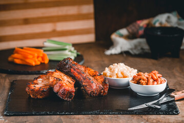 Take the front of a delicious dish of pork ribs with various side dishes. 