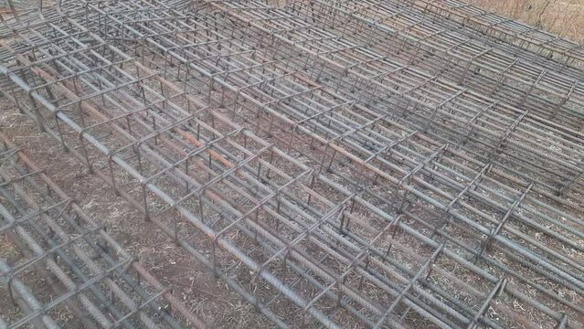 Reinforcement Steel column structure for building construction. The reinforcement frame of the column lies on the construction site - Reinforcement Column For Construction