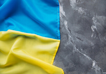 Ukrainian flag on a stone background.