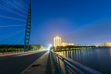 Bridge and city at night