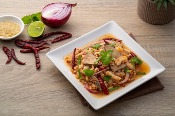 Spicy minced pork salad ,Laab moo ,Mixed Pork with boiled skin and liver in spicy lime sauce