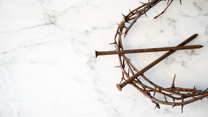 Crucifixion Of Jesus / religion easter background - Crown Of Thorns and rusty old nails on white marble marble Ground or table or altar
