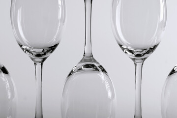 A close-up of wine glasses in black and white
