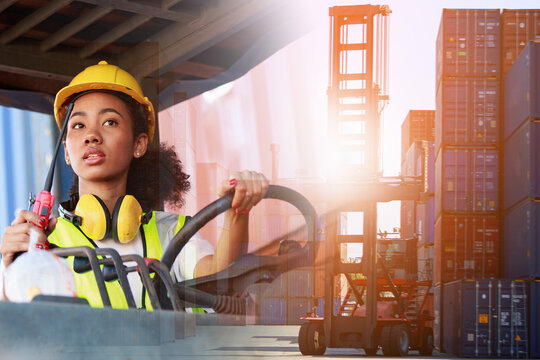 Double Exposure An African American woman in uniform and a helmet is driving a diesel forklift to lift a cargo container at the port