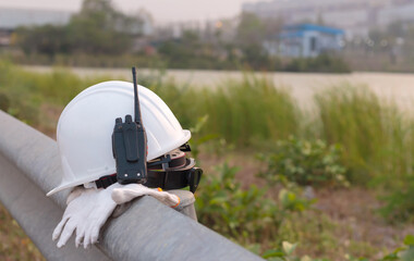 Radio transmitter and white helmet, engineer or worker safety equipment.
