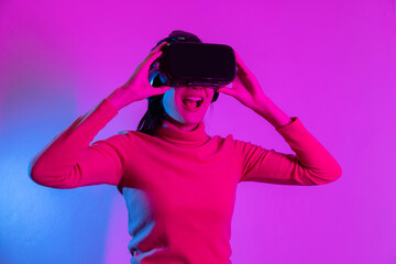 Woman with VR Headset with Futuristic Style Purple Light