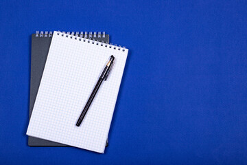 School spiral notebook isolated on a blue background