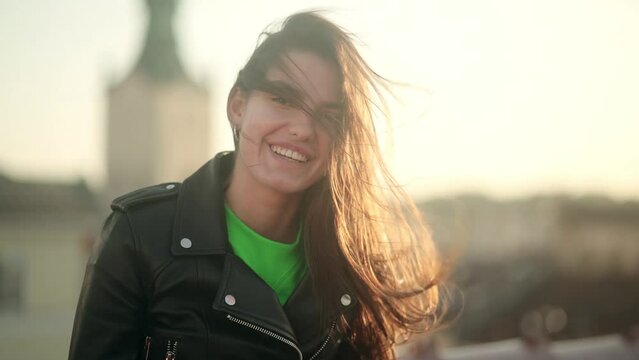 Close Up Portrait of beautiful woman Standing on the Wind. Breeze is playing with girls hair. Portrait of gorgeous girl