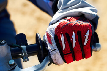 Fototapeta premium Hes ready to race. Cropped shot a dirtbiker with his hand on the throttle.