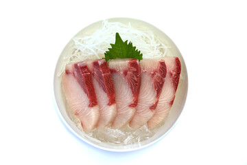 Sashimi, sliced hamachi, placed on ice in a bowl.