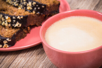 Zucchini dough and cup of white coffee on board. Delicious dessert