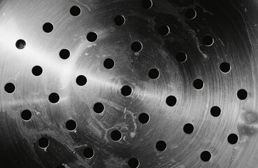 Holes in metal background