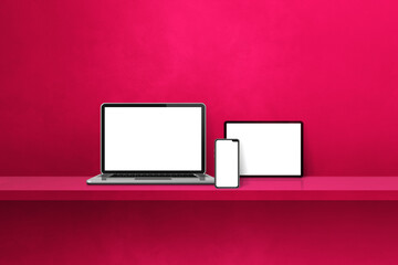Laptop, mobile phone and digital tablet pc on pink wall shelf. Horizontal background