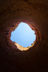 A sunny spring day landscape of old red brick ruins in the forest. Old building in the Northern Europe.