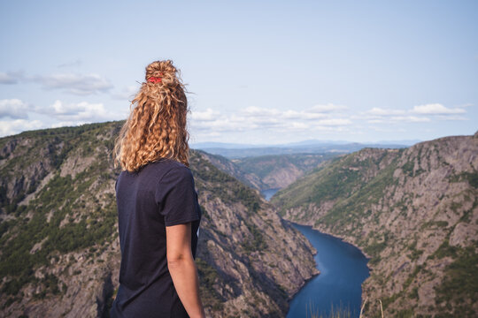 Woman hiker standing and looking at Sil Canyon