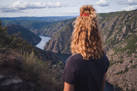 Woman hiker standing and looking at Sil Canyon