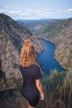 Woman hiker standing and looking at Sil Canyon