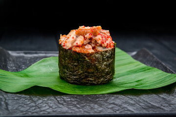 Sushi roll gunkan with smoked eel and caviar