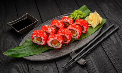 Sushi California rolls with salmon and red tobiko caviar