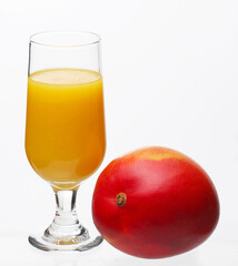 Mango juice glass and mango fruit isolated on white background.