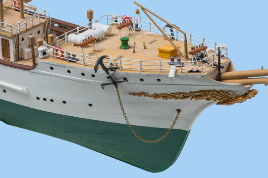 Close up view of wooden model of bow of ship Danmark isolated on blue background. Handmade model of ship  Danmark .. obby concept. Sweden.