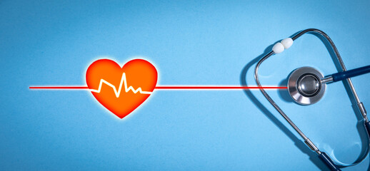 Heartbeat and stethoscope on the blue background.