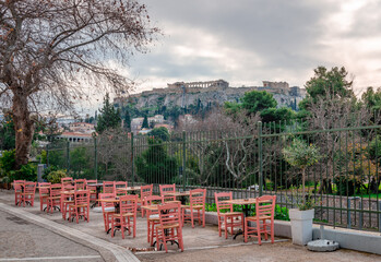 Sidewalk cafe in Adrianou St, next to the Ancient Agora, with the historic district of Plaka and...