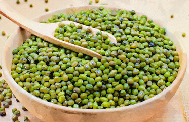 Green bean or mung bean in bowl and sack background.