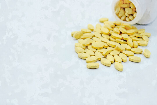 Natural vitamin supplements on the white background.