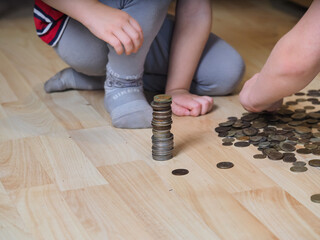 cash money coin stack growth child hand