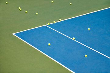 When practice is over.... Tennis balls lying on an empty court.