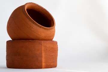 Pottery made of clay on a white background and copy space. Close-up of clay pots.