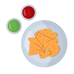 Nachos. Mexican cuisine dish. Plates with appetizers and sauces.
