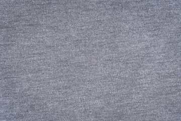 Fototapeta na wymiar The texture of the grey fabric. Grey cotton texture. Denim