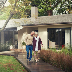 Enjoying the fresh air. Shot of a loving senior couple taking a walk outside.