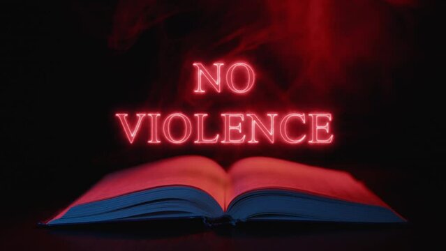No violence. Such an inscription of red letters appears above an open old book. A symbol of faith and love.