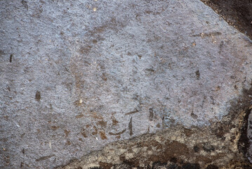Abstract stone background. The texture of the stone wall. Close-up. Light gray rock backdrop.