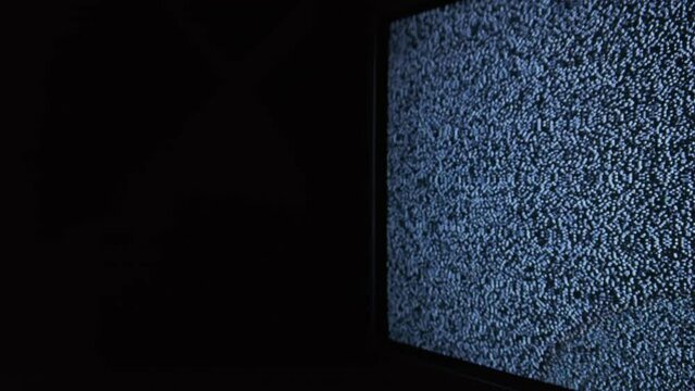 Static TV noise, analog signal. Television screen with static noise, bad signal. Vintage screen. Monochrome, black and white flickering noise. TV effects, artifacts, bad interference. Retro 80s, 90s.
