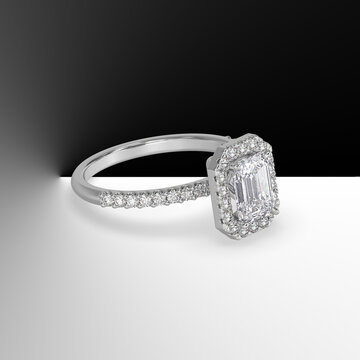 white gold halo engagement ring with emerald cut center stone and side stones on shank 3d render