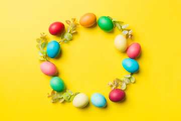 round frame Multi colors Easter eggs on colored background . Pastel color Easter eggs holiday concept with empty space for you design