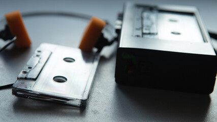 Music listening concept. Vintage cassette tape, audio player and headphones.