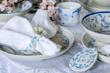 Easter table setting with empty craft ceramic tableware
